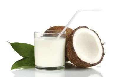 Pouring plant milk into a glass